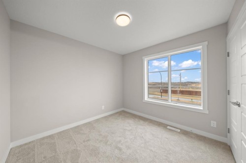 21 Sora Gate Se, Calgary, AB - Indoor Photo Showing Other Room