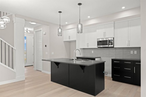 21 Sora Gate Se, Calgary, AB - Indoor Photo Showing Kitchen With Upgraded Kitchen