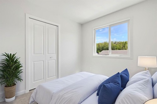9 Park Lane, Didsbury, AB - Indoor Photo Showing Bedroom