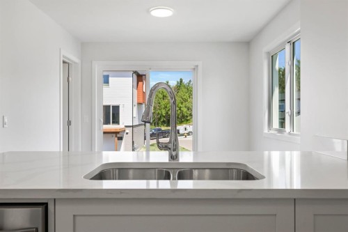 9 Park Lane, Didsbury, AB - Indoor Photo Showing Kitchen With Double Sink