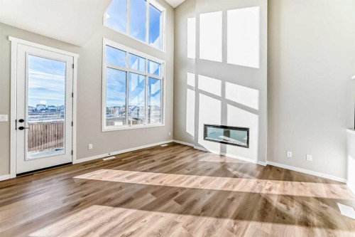 1089 Sawgrass Link Nw, Airdrie, AB - Indoor With Fireplace
