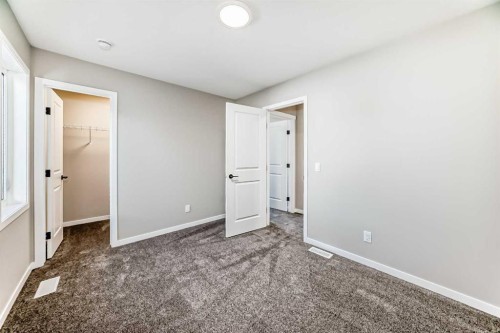 1089 Sawgrass Link Nw, Airdrie, AB - Indoor Photo Showing Other Room