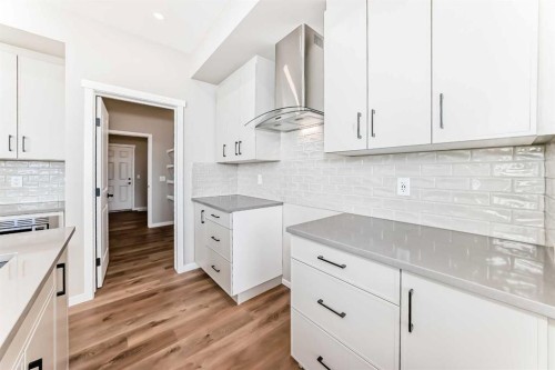 1089 Sawgrass Link Nw, Airdrie, AB - Indoor Photo Showing Kitchen With Upgraded Kitchen