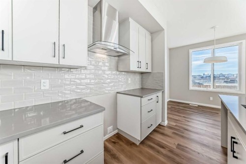 1089 Sawgrass Link Nw, Airdrie, AB - Indoor Photo Showing Kitchen With Upgraded Kitchen