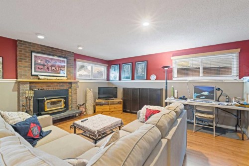 276 Macewan Glen Drive Nw, Calgary, AB - Indoor Photo Showing Living Room With Fireplace