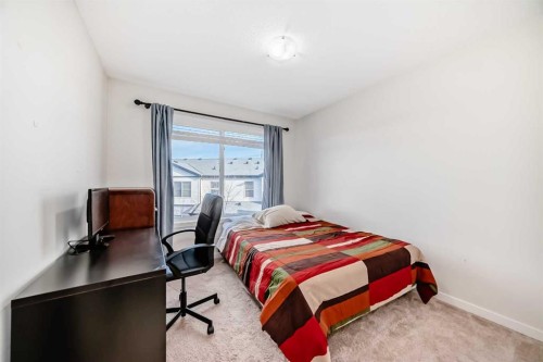 48 Copperpond Landing Se, Calgary, AB - Indoor Photo Showing Bedroom
