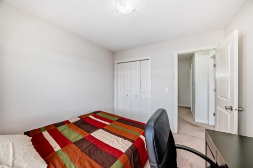 48 Copperpond Landing Se, Calgary, AB - Indoor Photo Showing Bedroom