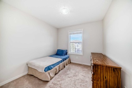 48 Copperpond Landing Se, Calgary, AB - Indoor Photo Showing Bedroom