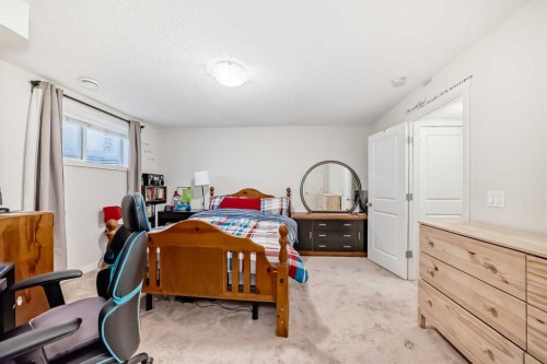 48 Copperpond Landing Se, Calgary, AB - Indoor Photo Showing Bedroom