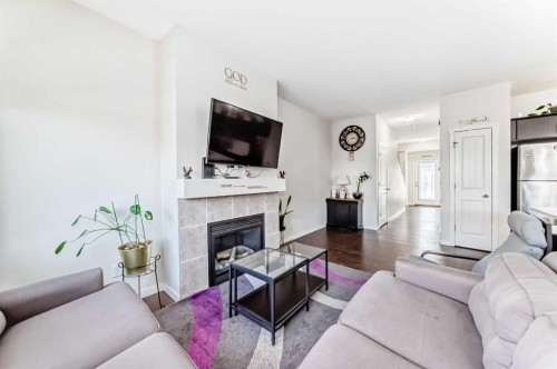 48 Copperpond Landing Se, Calgary, AB - Indoor Photo Showing Living Room With Fireplace