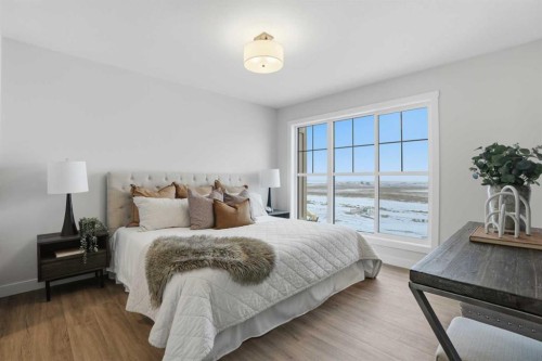 77 Wild Rose Way Se, Calgary, AB - Indoor Photo Showing Bedroom