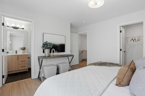 77 Wild Rose Way Se, Calgary, AB - Indoor Photo Showing Bedroom