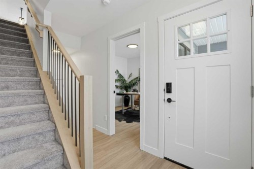 77 Wild Rose Way Se, Calgary, AB - Indoor Photo Showing Other Room