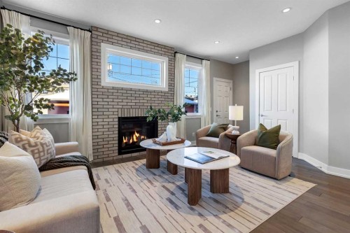 2522 1 Avenue Nw, Calgary, AB - Indoor Photo Showing Living Room With Fireplace