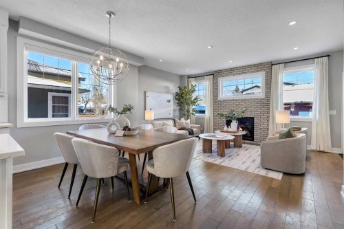 2522 1 Avenue Nw, Calgary, AB - Indoor Photo Showing Dining Room With Fireplace