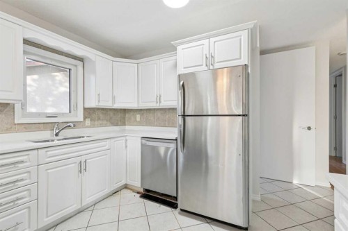 354 Maitland Hill Ne, Calgary, AB - Indoor Photo Showing Kitchen With Double Sink