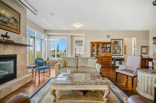 404-4 Hemlock Crescent Sw, Calgary, AB - Indoor Photo Showing Living Room With Fireplace