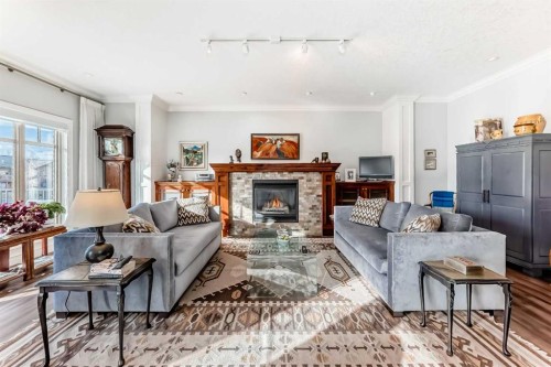 41 Bridle Estates Manor Sw, Calgary, AB - Indoor Photo Showing Living Room With Fireplace