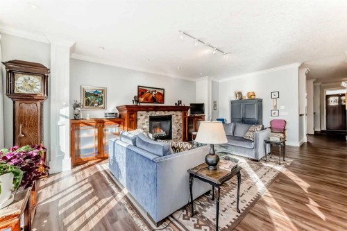 41 Bridle Estates Manor Sw, Calgary, AB - Indoor Photo Showing Living Room With Fireplace