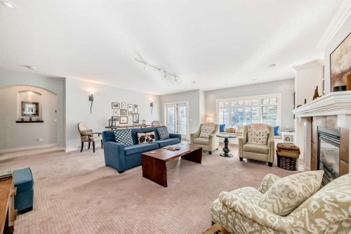41 Bridle Estates Manor Sw, Calgary, AB - Indoor Photo Showing Living Room With Fireplace