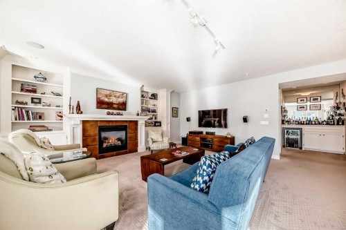 41 Bridle Estates Manor Sw, Calgary, AB - Indoor Photo Showing Living Room With Fireplace