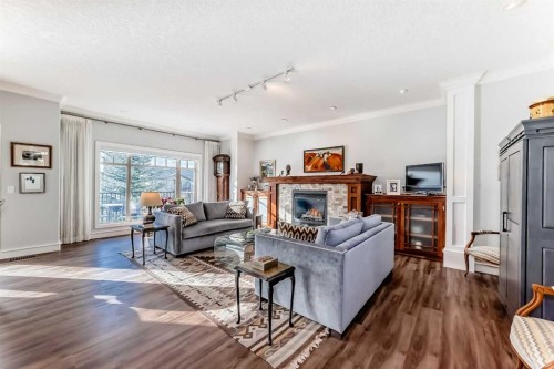 41 Bridle Estates Manor Sw, Calgary, AB - Indoor Photo Showing Living Room With Fireplace