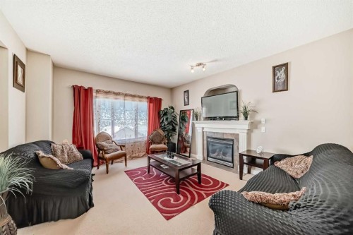 292 Taralake Terrace Ne, Calgary, AB - Indoor Photo Showing Living Room With Fireplace