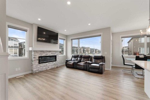 7 Corner Glen Common Ne, Calgary, AB - Indoor Photo Showing Living Room With Fireplace