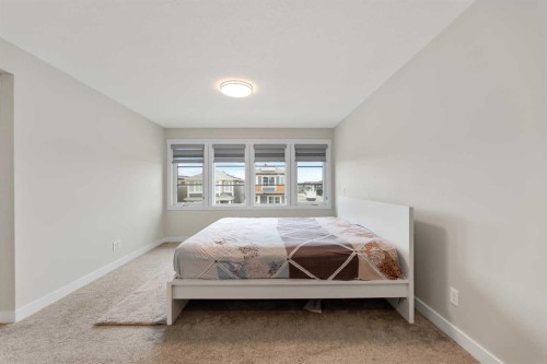 7 Corner Glen Common Ne, Calgary, AB - Indoor Photo Showing Bedroom