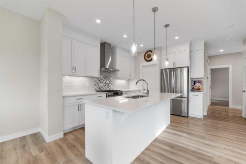 7 Corner Glen Common Ne, Calgary, AB - Indoor Photo Showing Kitchen With Stainless Steel Kitchen With Double Sink With Upgraded Kitchen