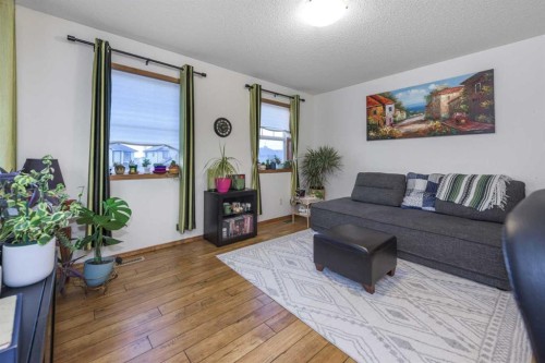74 Tuscany Springs Hill Nw, Calgary, AB - Indoor Photo Showing Living Room