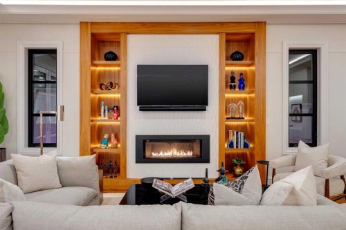 1118 Premier Way Sw, Calgary, AB - Indoor Photo Showing Living Room With Fireplace