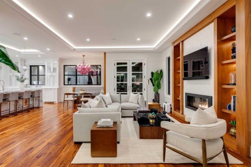 1118 Premier Way Sw, Calgary, AB - Indoor Photo Showing Living Room With Fireplace