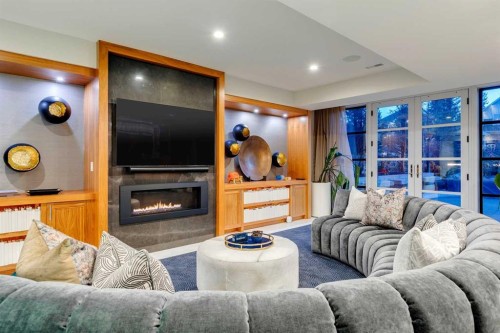 1118 Premier Way Sw, Calgary, AB - Indoor Photo Showing Living Room With Fireplace
