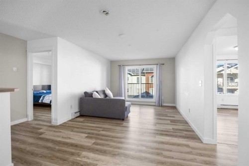 2205-70 Panamount Drive Nw, Calgary, AB - Indoor Photo Showing Living Room