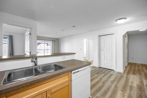 2205-70 Panamount Drive Nw, Calgary, AB - Indoor Photo Showing Kitchen With Double Sink
