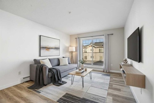 2205-70 Panamount Drive Nw, Calgary, AB - Indoor Photo Showing Living Room