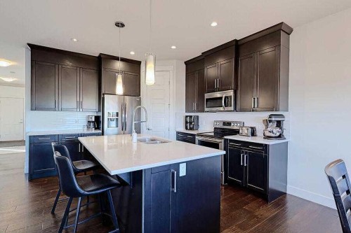 1708 Monteith Drive Se, High River, AB - Indoor Photo Showing Kitchen With Double Sink With Upgraded Kitchen