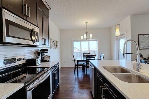 1708 Monteith Drive Se, High River, AB - Indoor Photo Showing Kitchen With Double Sink
