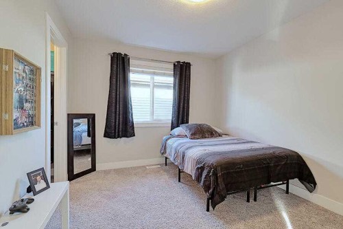 1708 Monteith Drive Se, High River, AB - Indoor Photo Showing Bedroom