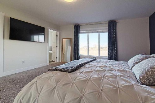 1708 Monteith Drive Se, High River, AB - Indoor Photo Showing Bedroom