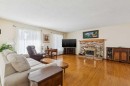 11427 Wilkes Road Se, Calgary, AB  - Indoor Photo Showing Living Room With Fireplace 