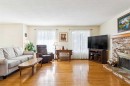 11427 Wilkes Road Se, Calgary, AB  - Indoor Photo Showing Living Room With Fireplace 