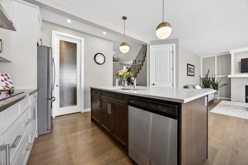 144 Sundown View, Cochrane, AB - Indoor Photo Showing Kitchen With Upgraded Kitchen