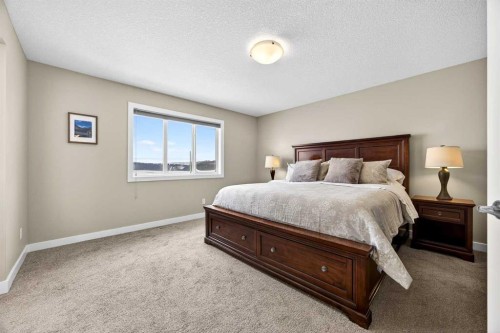 144 Sundown View, Cochrane, AB - Indoor Photo Showing Bedroom