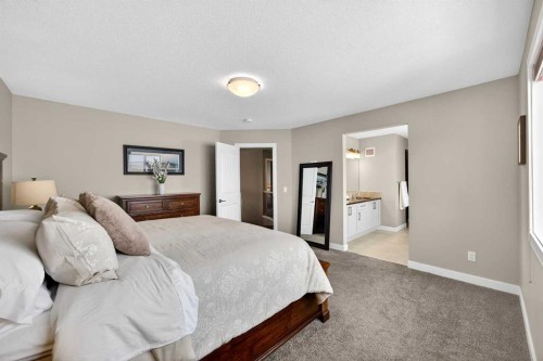 144 Sundown View, Cochrane, AB - Indoor Photo Showing Bedroom