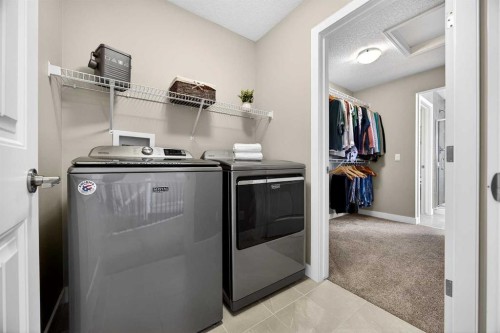 144 Sundown View, Cochrane, AB - Indoor Photo Showing Laundry Room