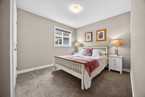 144 Sundown View, Cochrane, AB - Indoor Photo Showing Bedroom