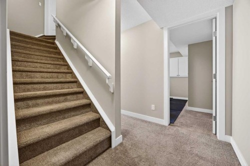 144 Sundown View, Cochrane, AB - Indoor Photo Showing Other Room