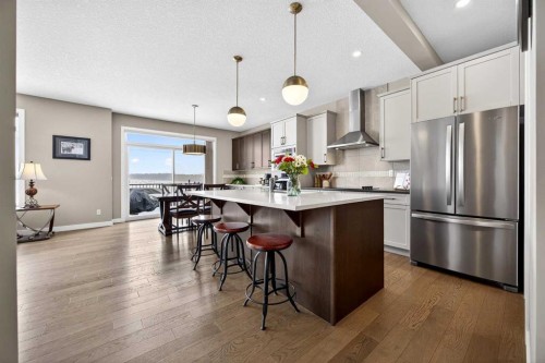 144 Sundown View, Cochrane, AB - Indoor Photo Showing Kitchen With Stainless Steel Kitchen With Upgraded Kitchen